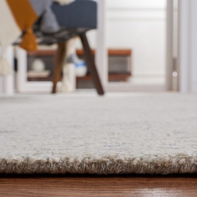 Ivory and Light Blue Floral Wool 8' x 10' Hand-Tufted Rug