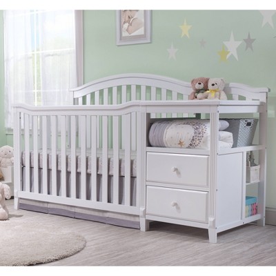 white crib with changing table