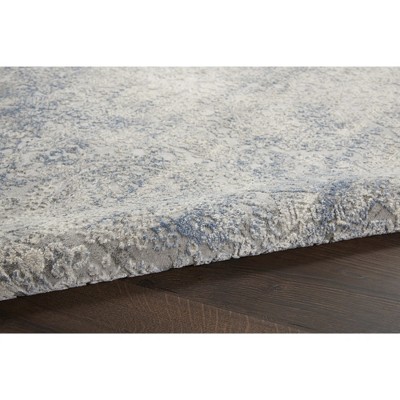 Ivory Elegance 5'3" x 7'3" Synthetic Vintage Persian Rug