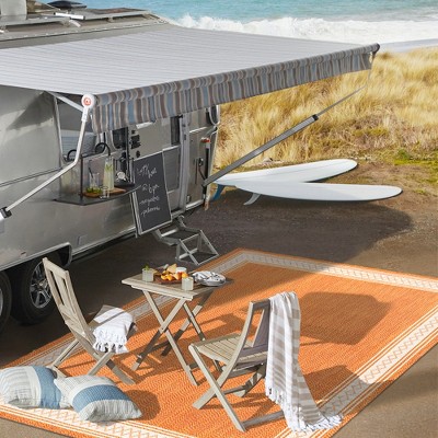 Lucia Cream and Orange Synthetic Indoor/Outdoor Area Rug
