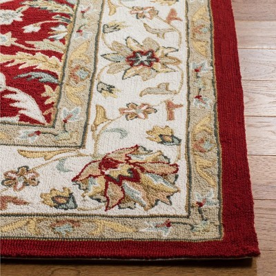 Red and Ivory Hand-Hooked Synthetic 6' x 9' Area Rug