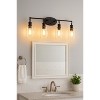 Sunset Lighting Clyde 4-Light Vanity, Steel Round Glass Clear Seedy, Matte Black Finish - 3 of 3