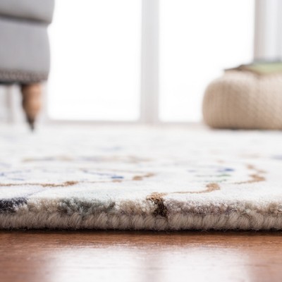 Ivory and Blue Hand-Tufted Wool 9' x 12' Area Rug