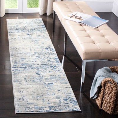 Ivory and Blue Abstract Hand-knotted Synthetic Rug, 2' x 4'