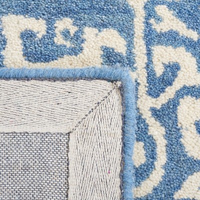 Blue and Ivory Hand Tufted Wool Area Rug 5' x 8'