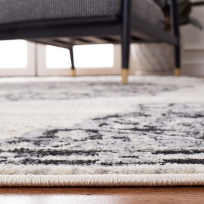 Ivory and Black Synthetic Rectangular 8' x 10' Area Rug