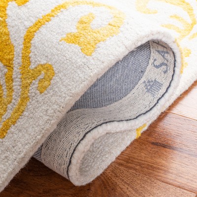 Handmade Ivory and Gold Wool Rectangular Accent Rug, 2' x 3'