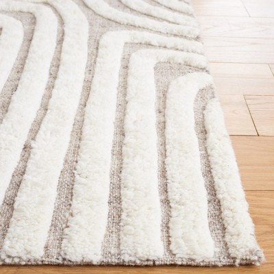 Ivory and Beige 6' x 9' Handmade Wool and Cotton Rug