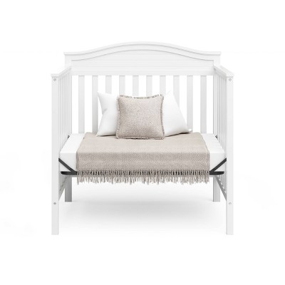 Stella White Pine Wood 4-in-1 Convertible Mini Crib with Foam Mattress