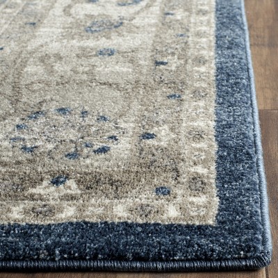 Navy and Beige Floral Border Synthetic Area Rug 8' x 10'