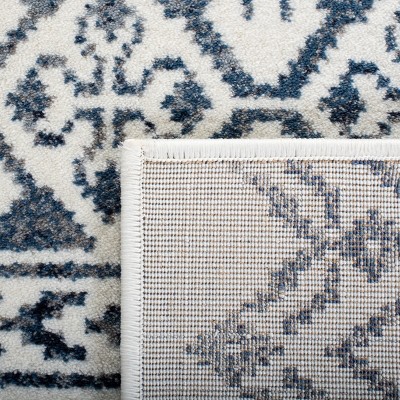 Ivory Rectangular 9' x 12' Stain-Resistant Synthetic Area Rug