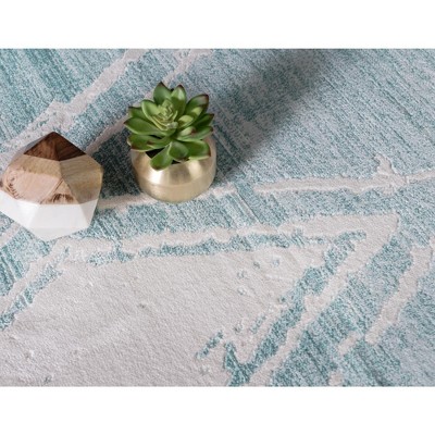 Turquoise and Ivory Rectangular Synthetic Indoor Rug, 5' x 8'