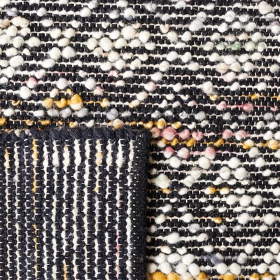 Ivory and Black Handwoven Wool Area Rug, 5' x 8'