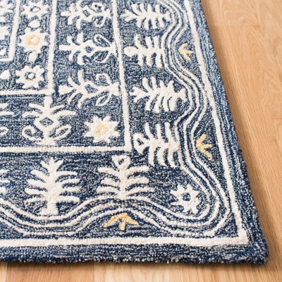 Handmade Blue and Ivory Tufted Wool Area Rug