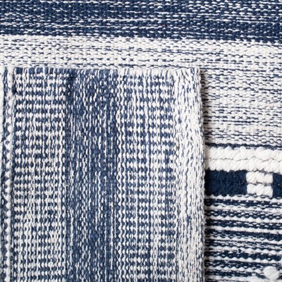 Ivory and Navy Handmade Kilim Wool Area Rug with Cowhide Accents