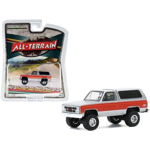 1984 gmc jimmy sierra classic lifted silver with red stripes all terrain series 10 1 64 diecast model car by greenlight target 1984 gmc jimmy sierra classic lifted silver with red stripes all terrain series 10 1 64 diecast model car by greenlight