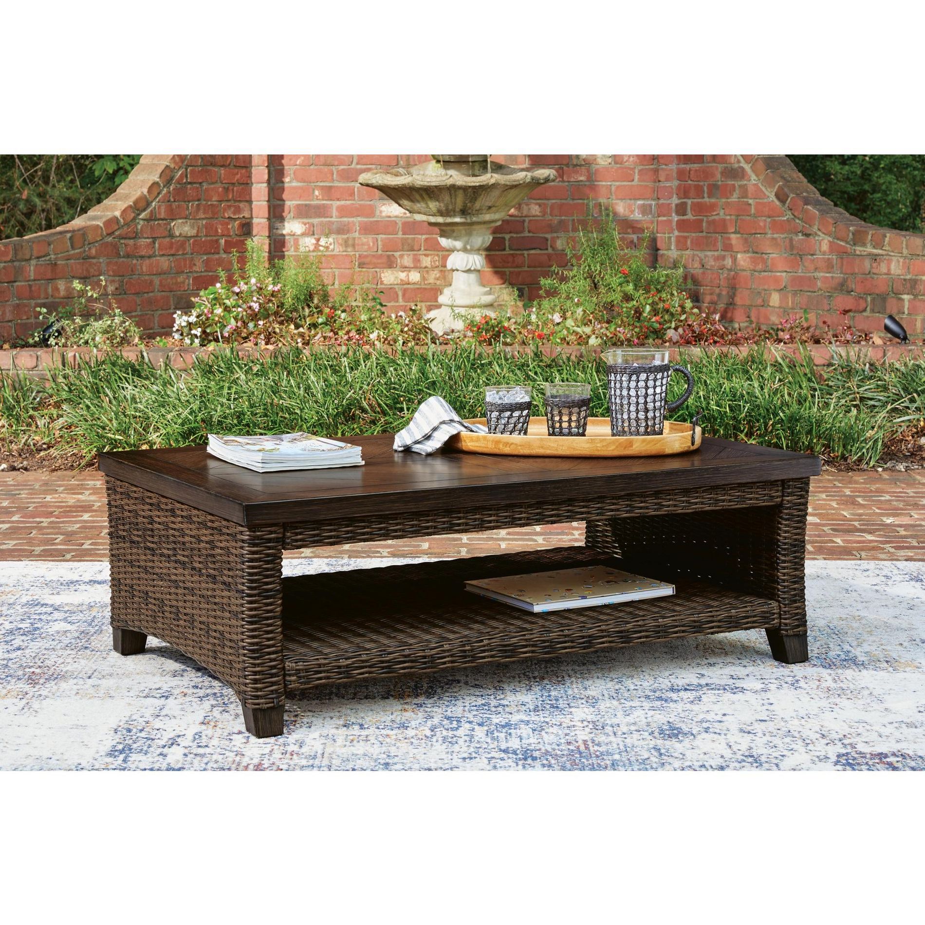 Signature Design by Ashley Drakes Beach Outdoor Rectangular Coffee Table, Dark Brown, Wicker Patio Cocktail Table with Storage Shelf