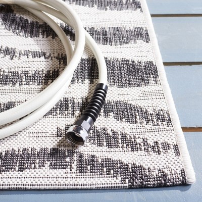 Ivory and Black Animal Print Indoor/Outdoor Rug