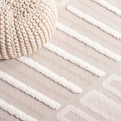 Ivory and Beige Geometric Synthetic 8' x 10' Area Rug