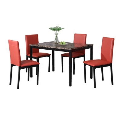 Dining table with four red upholstered chairs on white background