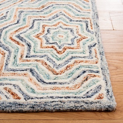 Capri Blue and Rust Hand-Tufted Wool Area Rug 6' x 9'
