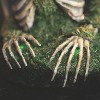 Morris Costumes 15 in Animated Mossy Skeleton Tabletop Decoration - White - 2 of 3