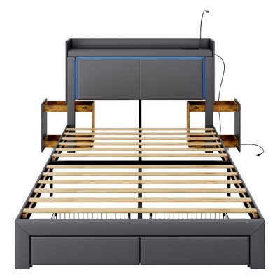 Vlsrka Queen Bed with LED lights and charging station, upholstered headboard with drawers, nightstand, and reading lamp.