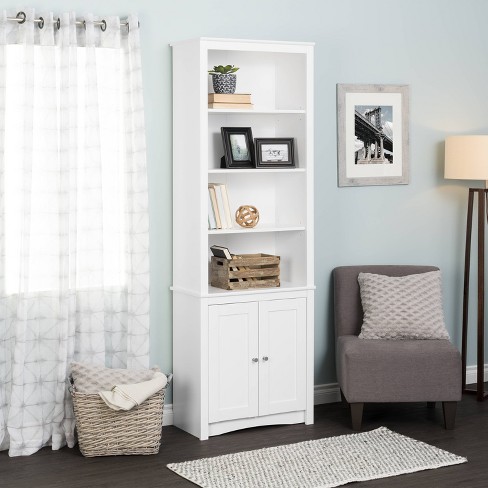 Tall white bookcase with shop doors