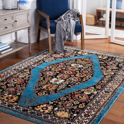 Vintage Blue and Black Synthetic Rectangular Area Rug 6'7" x 9'