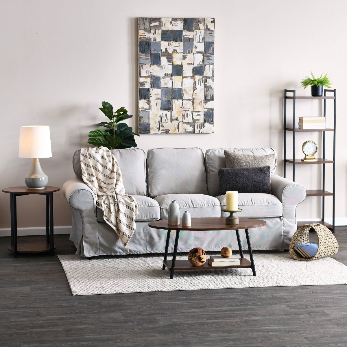 Round dark wood accent end table with black metal base and lower shelf