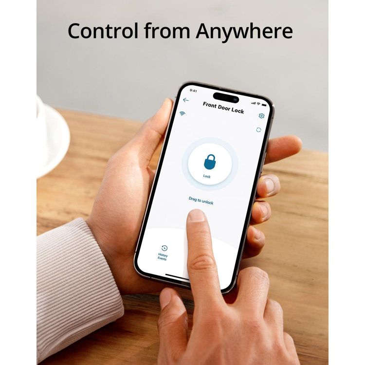 A person holding a smartphone displaying a front door lock app with a "Lock" button and "Drag to unlock" text.