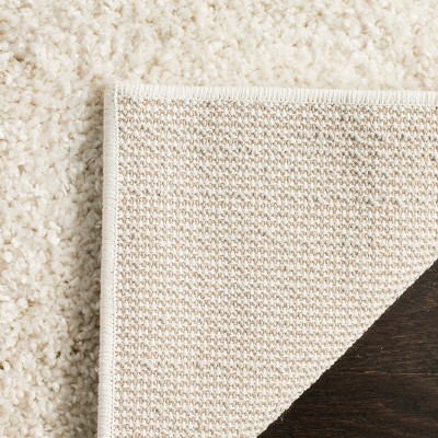 Cream 8' x 10' Tufted Shag Area Rug