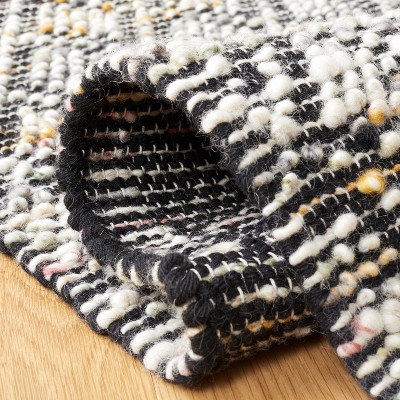 Ivory and Black Handwoven Wool Area Rug, 5' x 8'