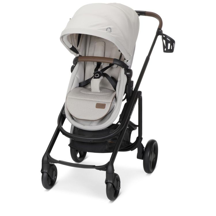 A light gray colored stroller with a canopy, black frame, and brown handlebar, featuring a cup holder and four wheels.