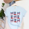 Simply Sage Market Patriotic Boots Stacked Coquette Garment Dyed Tee - 3 of 4