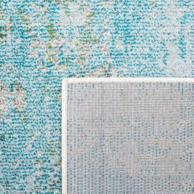Light Blue and Green Abstract Distressed 6' x 9' Rug