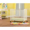 Child Craft Siesta Metal Compact Non-Folding Portable Crib with 2" Crib Mattress and Locking Wheels, Durable Metal Construction, Easy to Clean (White) - 2 of 4