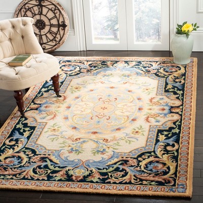 Ivory and Navy Handmade Wool Floral Area Rug