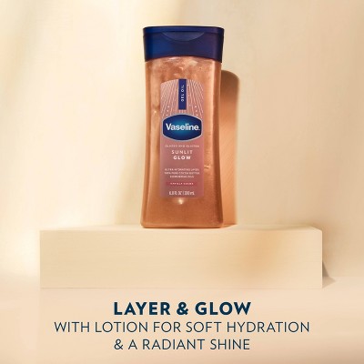 Vaseline Sunlit Glow Lotion, 6.8 fl oz, glistens on a beige pedestal. Text reads: 
