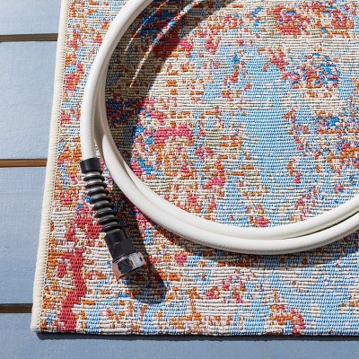 Summer Light Blue and Ivory Synthetic Area Rug 6'6" x 9'4"