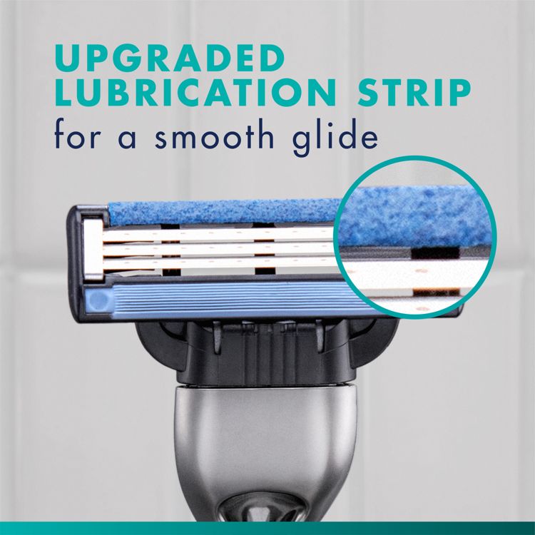 Razor head with three visible blades, a blue colored lubrication strip and a silver colored handle, with text reading "UPGRADED LUBRICATION STRIP for a smooth glide".