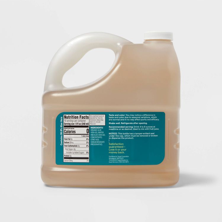 A large jug filled with light brown colored liquid featuring a handle and a label displaying nutrition facts and ingredients.