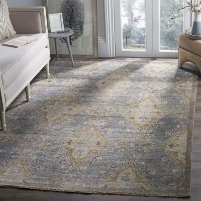 Handmade Brown Wool 6' x 9' Floral Area Rug