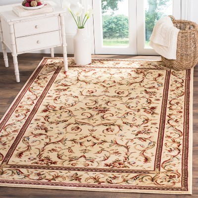 Ivory Floral Bordered Synthetic Area Rug 5'3" x 7'6"