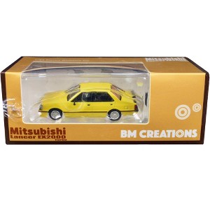 Mitsubishi Lancer EX2000 Turbo Yellow with Stripes with Extra Wheels 1/64 Diecast Model Car by BM Creations - 1 of 3