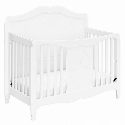 white crib with bow