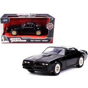 Tego's Pontiac Firebird Black with Gold Stripes and Hood Bird "Fast & Furious" Series 1/32 Diecast Model Car by Jada - 1 of 3