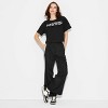 Women's Messi Short Sleeve Graphic Crop Top - Black - image 3 of 3