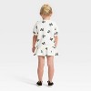 Toddler Girls' 2pc Disney Minnie Mouse Short Sleeve Top and Skort Set - Ivory - 2 of 4