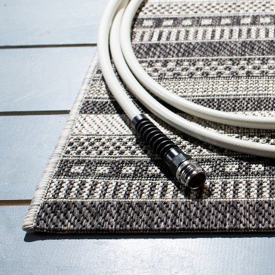 Black and Gray Striped 8' x 10' Synthetic Indoor/Outdoor Rug